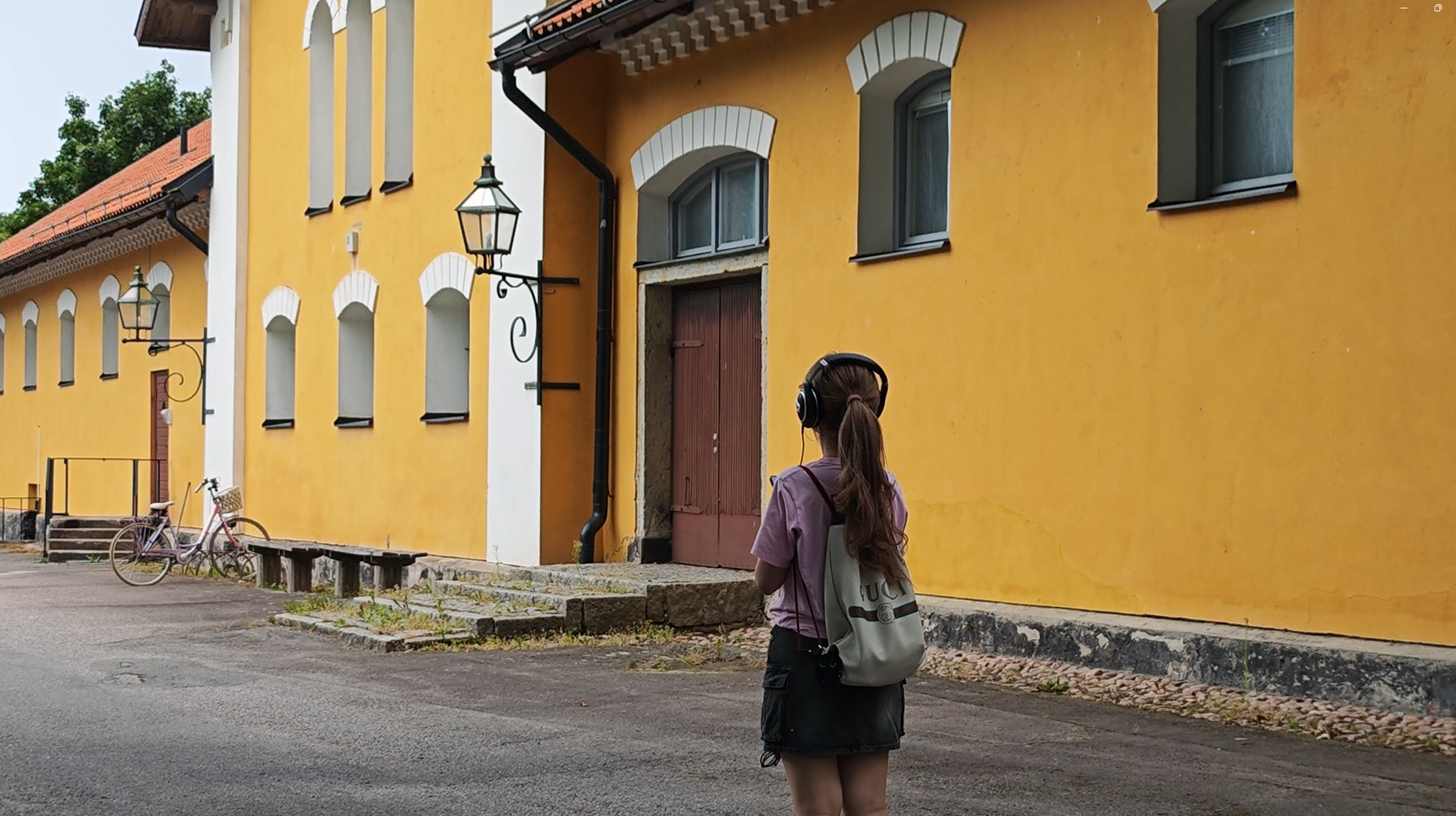 Player listening to the story in front of a historical site